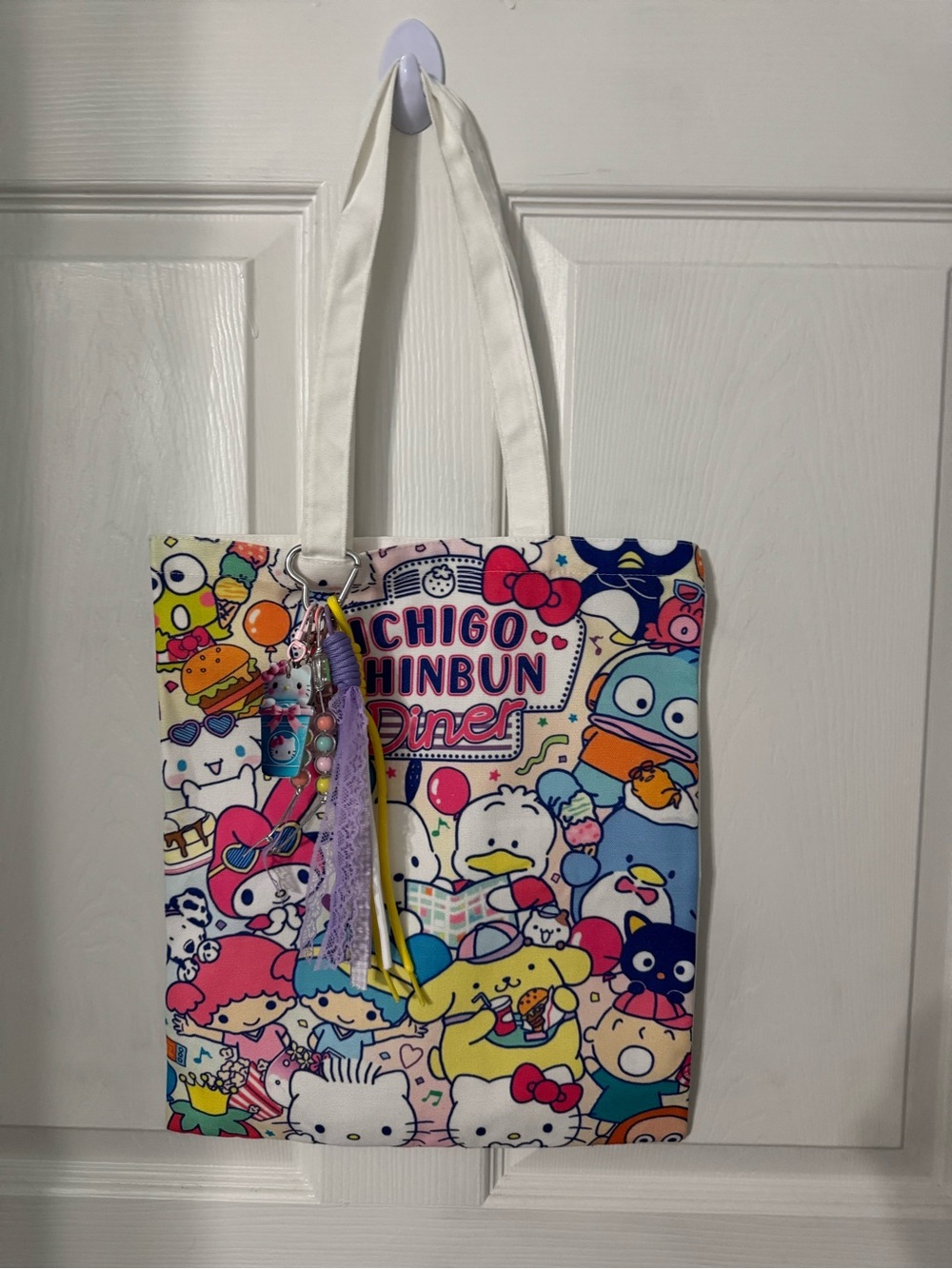 Sanrio-Style Character Print Tote Bag in Multicolor with bag charm.